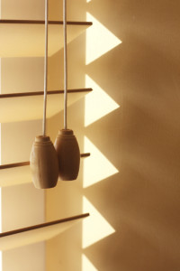 Close up of a few slats of wooden blinds